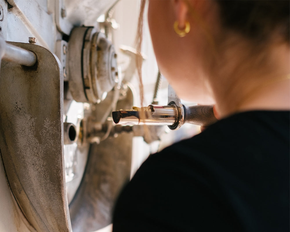 Roastery Manager, Katie, thoughtfully roasting coffee.