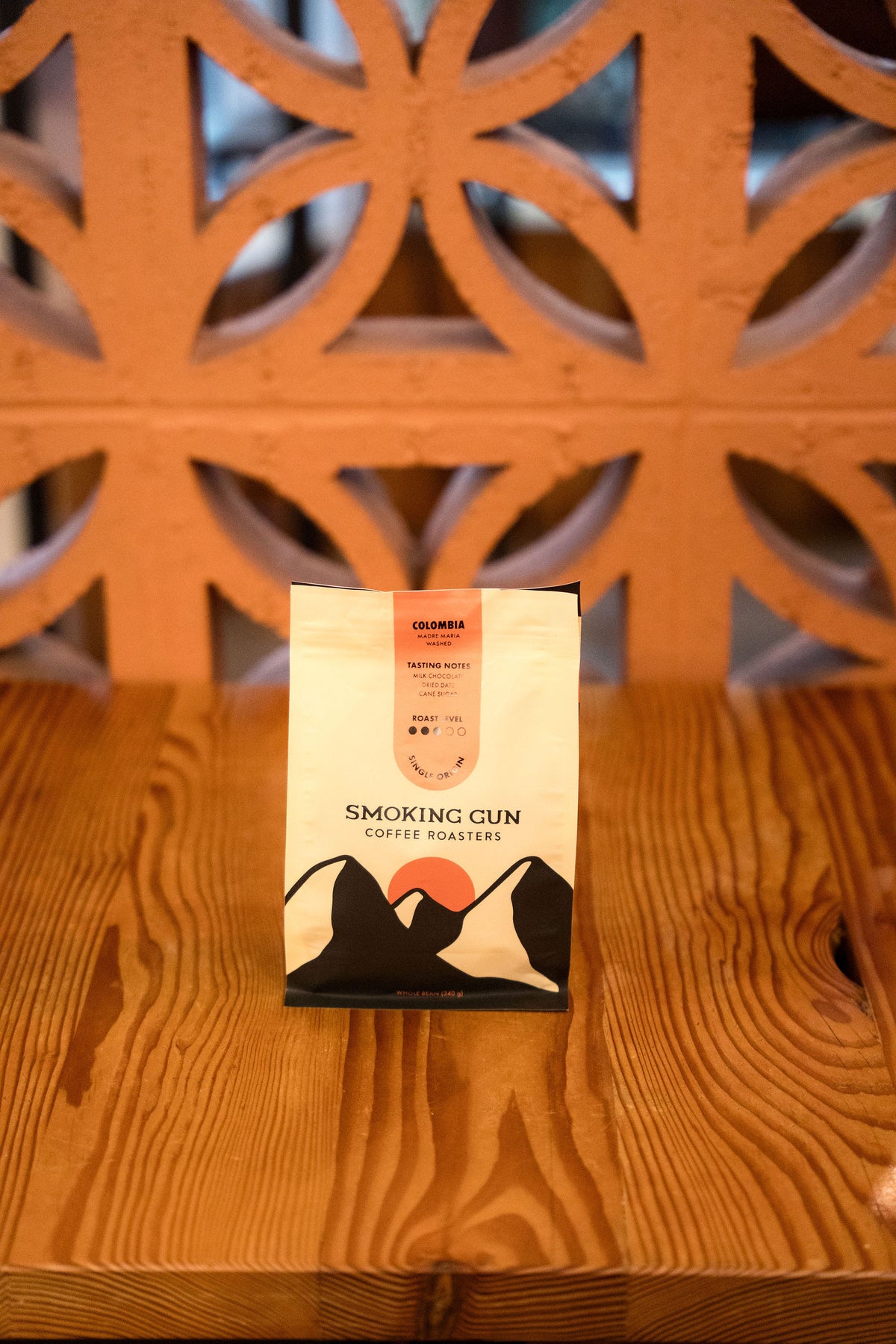 Colombia Madre Maria 340 g bag on a café table